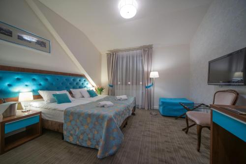 Posteľ alebo postele v izbe v ubytovaní Hotel Kazimierzówka