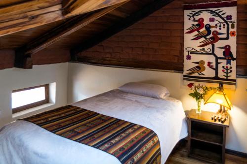 Postel nebo postele na pokoji v ubytování Hostal Alcala