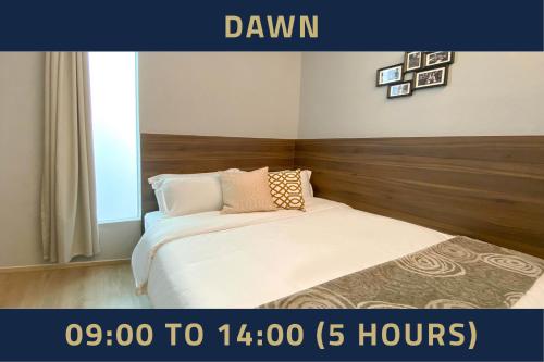 a bedroom with a bed and a window and avertisement at ST Signature Bugis Beach, DAYUSE, 5 Hours, 9AM-2PM in Singapore