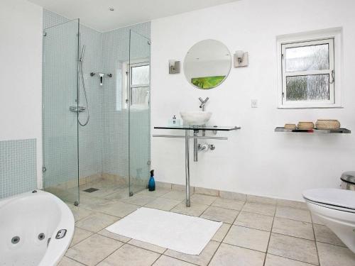a bathroom with a shower and a sink and a toilet at 5 person holiday home in Skagen-By Traum in Skagen