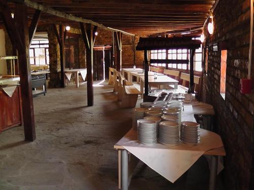 a dining room with tables with plates on them at Festa-Kranevo in Kranevo