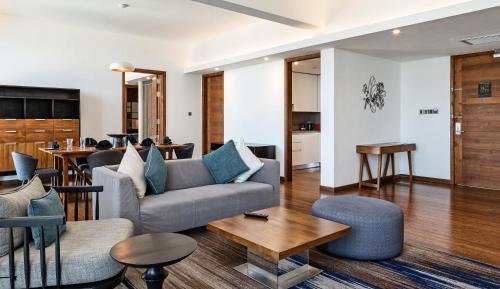 a living room with a couch and a table at Jetwing Colombo Seven in Colombo