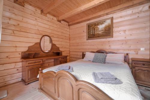 Postel nebo postele na pokoji v ubytování Villa Ladna Tatariv Bukovel