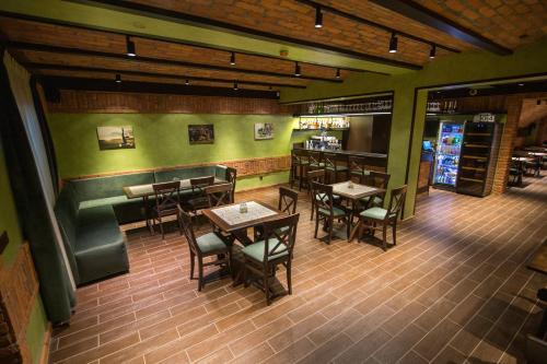 an overhead view of a restaurant with tables and chairs at Praktik Hotel & Restaurant in Berehove
