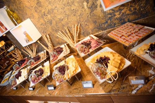 a table filled with different types of desserts and pastries at Kazakhstan Express in Almaty