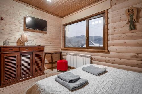 Postel nebo postele na pokoji v ubytování Villa Ladna Tatariv Bukovel