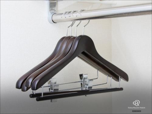a group of baseballoons hanging from a rack at Daiwa Roynet Hotel Yokohama Kannai in Yokohama
