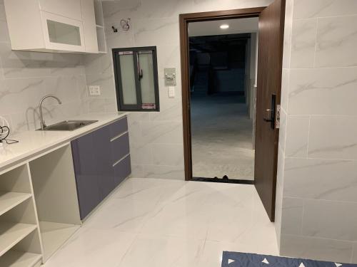 Η κουζίνα ή μικρή κουζίνα στο Smiley Apartment Quận 2