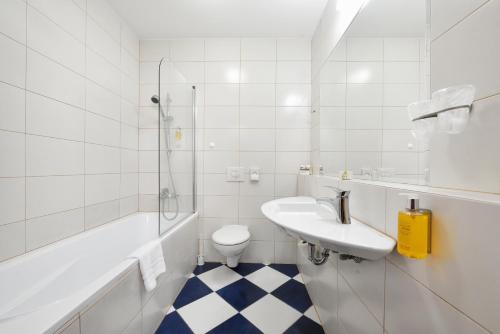 Koupelna v ubytování City Hotel