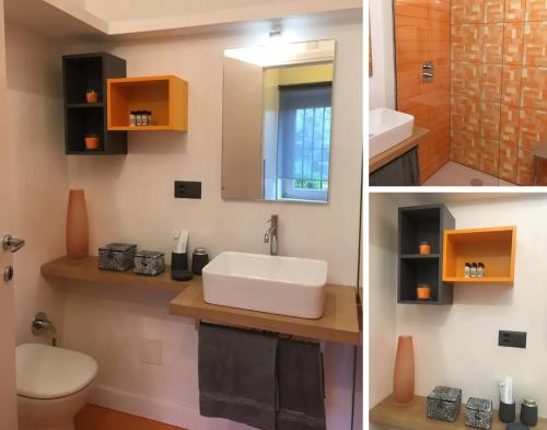 uma casa de banho com um lavatório, um WC e um espelho. em Charming Castagnola em Lugano