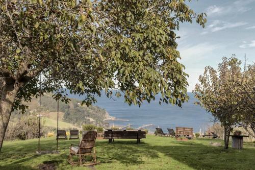 a group of chairs sitting around a table in a field at Arriola Txiki in Itziar