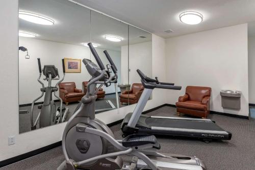 a gym with exercise bikes and a mirror at Quality Inn Kirksville in Kirksville