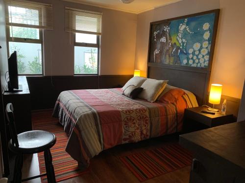 Postel nebo postele na pokoji v ubytování Hostal Boutique 180 Grados
