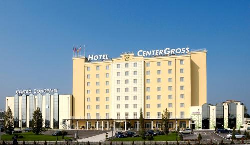 a hotel with a sign on the top of it at Zanhotel Centergross in Bentivoglio