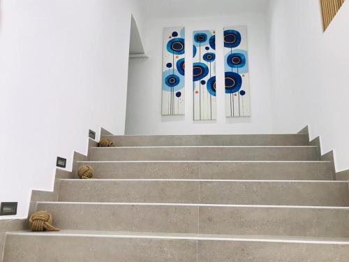 a staircase in a church with two stained glass windows at The Convo Athens Riviera in Athens
