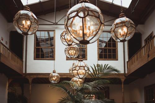 a group of lights hanging from the ceiling of a building at La Laguna Gran Hotel in La Laguna