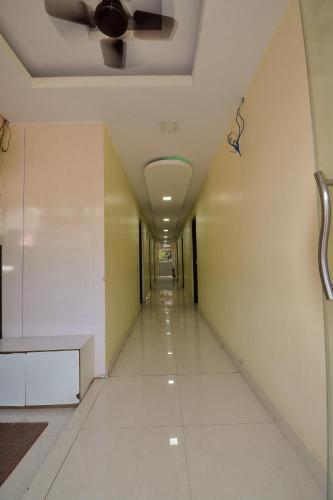 a corridor in an office building with a ceiling at HOTEL CORAL INN -HCI in Port Blair