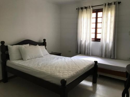 Voodi või voodid majutusasutuse Gravata em Condomínio LINDO - Casa com 200m com 4 QTS e 5 WC toas