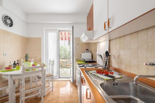 a kitchen with a sink and a counter top at Apartments Nono in Poreč