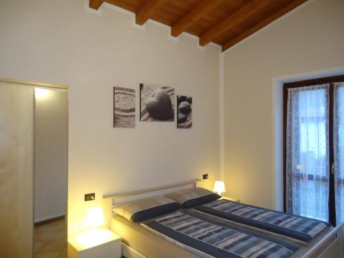 Postel nebo postele na pokoji v ubytování Casa Vittoria V1