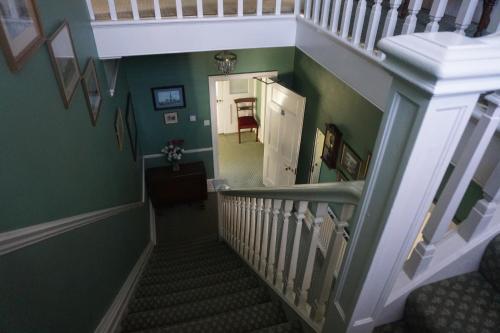 an overhead view of a hallway with a stairway at The Edwardian Lodge Guest House in Salisbury