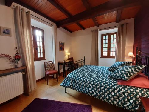 Ένα ή περισσότερα κρεβάτια σε δωμάτιο στο Le Sareymond