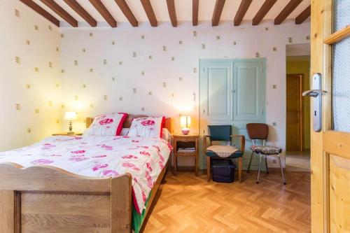 a bedroom with a bed and a table and chairs at Maison de 3 chambres avec jardin clos et wifi a Moraches in Moraches