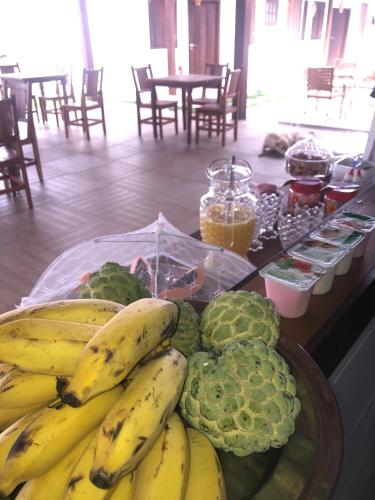 a bunch of bananas and other fruits and vegetables on a table at KUKA ZEN in Pirenópolis