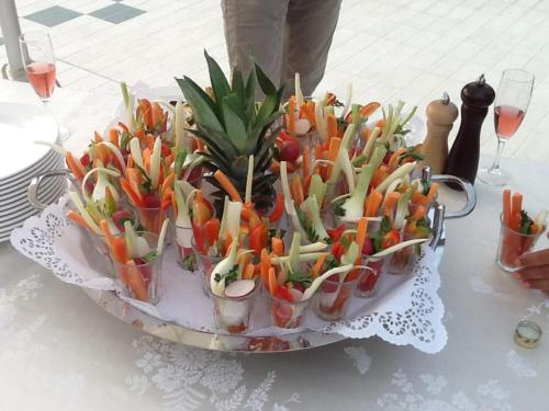a bunch of vegetables in cups on a table at Zanhotel Centergross in Bentivoglio