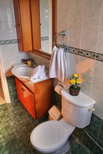 a bathroom with a toilet and a sink at Villa Paradise in Paphos