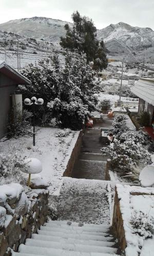 a set of stairs covered in snow at Hotel Las Vicuñas in Putre
