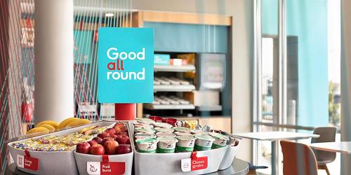 a display of food on a table in a store at avid hotels - Detroit - Warren by IHG in Warren