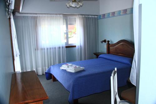 Ліжко або ліжка в номері Hostería Anchimalen