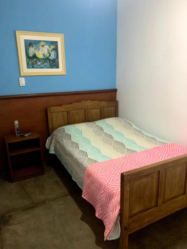 Uma cama ou camas num quarto em Pousada Manga Rosa