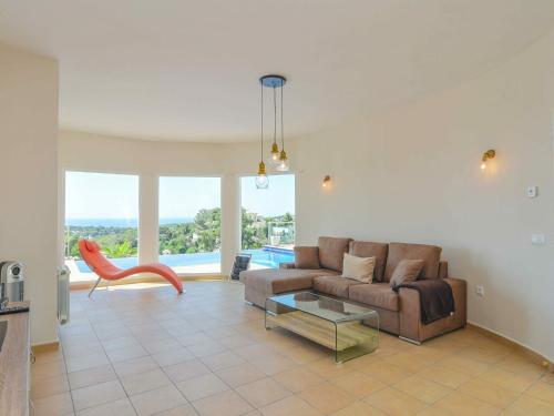 a living room with a couch and a table at Villa in Moraira with Pool near Beach in Moraira