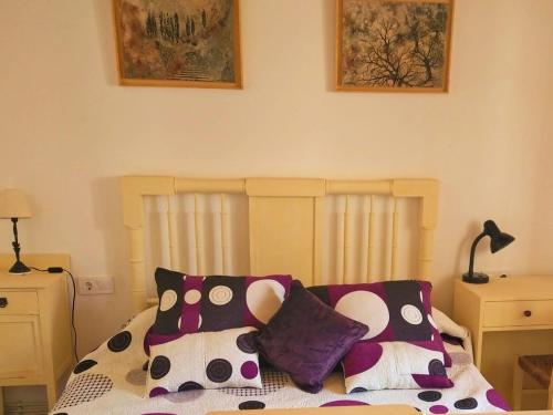 a bedroom with a bed with pillows on it at Hansel y Gretel in Pedrosa del Rey