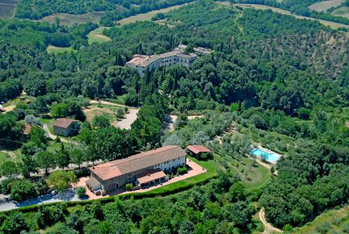 an aerial view of a building in the middle of a forest at Agriturismo Antico Borgo Poggitazzi in Loro Ciuffenna