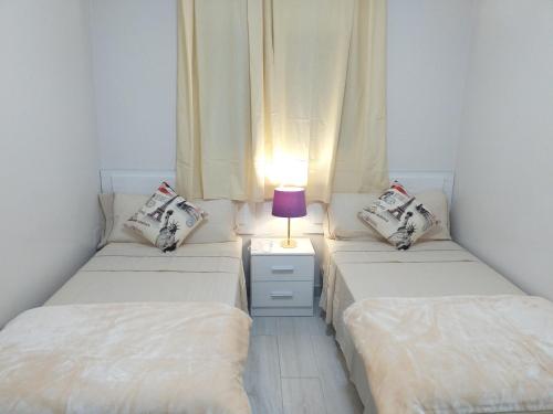 Postel nebo postele na pokoji v ubytování CASA PARAISO