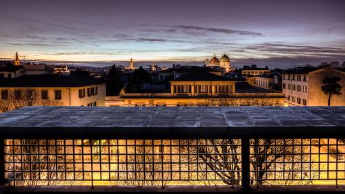 a view from the roof of a building at night at Forte16 View & SPA in Florence