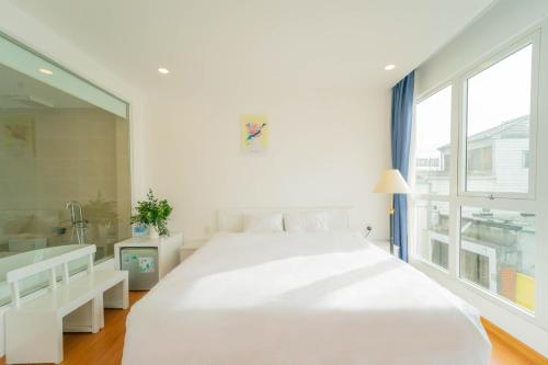 Postel nebo postele na pokoji v ubytování Xuan Cuong Hotel