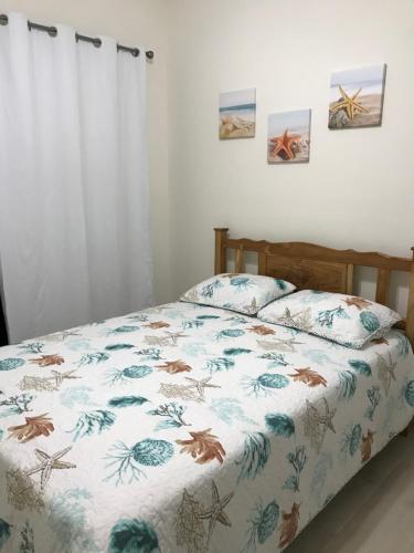 Säng eller sängar i ett rum på Playa Caracol Beachfront Residence Club