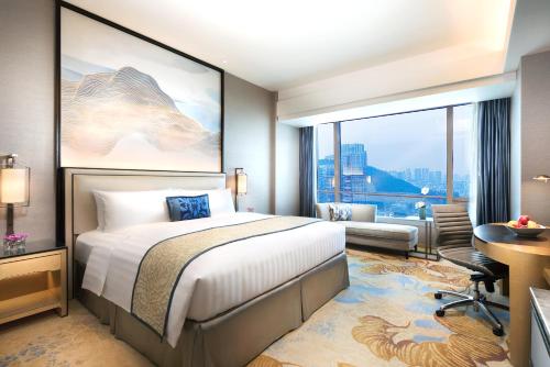 Postel nebo postele na pokoji v ubytování Shangri-La Xiamen
