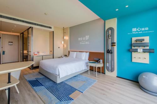 Postel nebo postele na pokoji v ubytování EVEN Hotel Nanjing Yangtze River by IHG