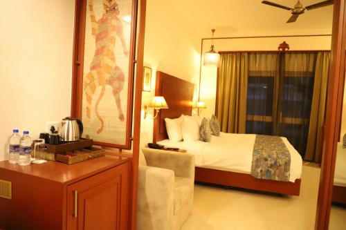 Ένα ή περισσότερα κρεβάτια σε δωμάτιο στο Hotel Chandela Khajuraho