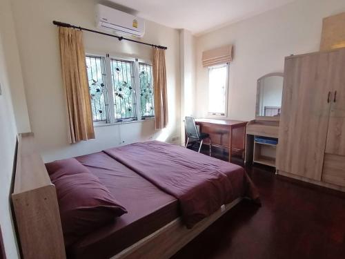 Una cama o camas en una habitación de Pool Villa Armthong Home