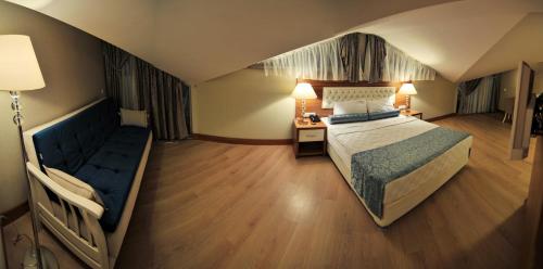 Postel nebo postele na pokoji v ubytování Exelans Hotel