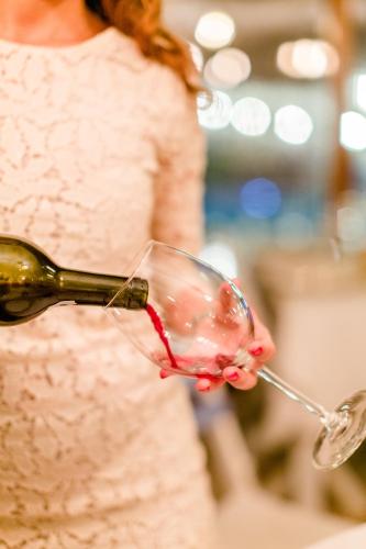 a woman is holding a glass of wine at Club Hotel Barbarossa in Kas