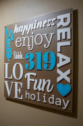 a sign that says happiness enjoy fun wednesday at City Hotel & Suites in Foligno