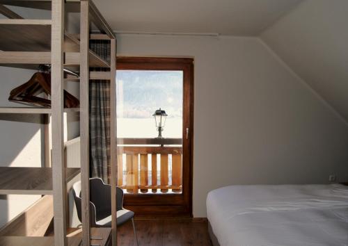 Двухъярусная кровать или двухъярусные кровати в номере Hotel Speiereck