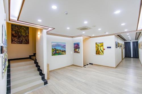 an art gallery with paintings on the walls at Art Deluxe Hotel in Tashkent